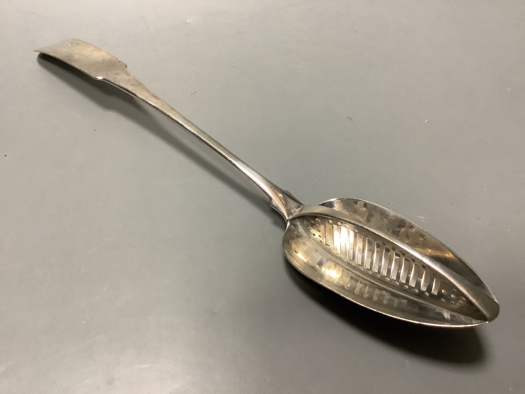 A George III Irish silver fiddle pattern straining spoon by John Power, Dublin, 1804, length 34 cm, 4.5 oz.